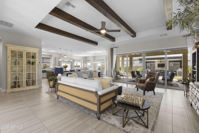 20795 W San Juan Ave, Buckeye, AZ 85396 - living area featuring a ceiling fan, beam ceiling, and light tile patterned floors