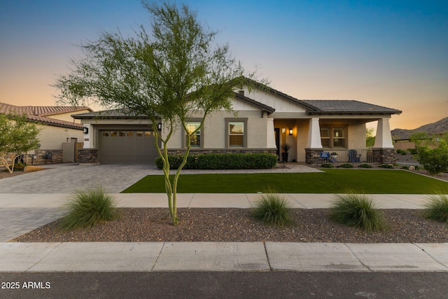 20795 W San Juan Ave, Buckeye, AZ 85396 - craftsman-style house with stone siding and stucco siding