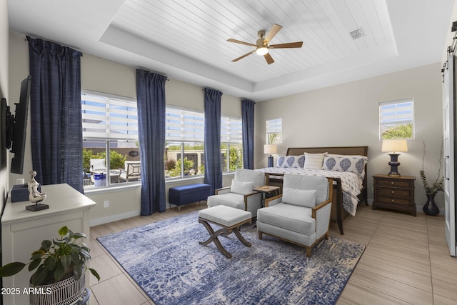 20795 W San Juan Ave, Buckeye, AZ 85396 - bedroom featuring a raised ceiling, baseboards, and ceiling fan