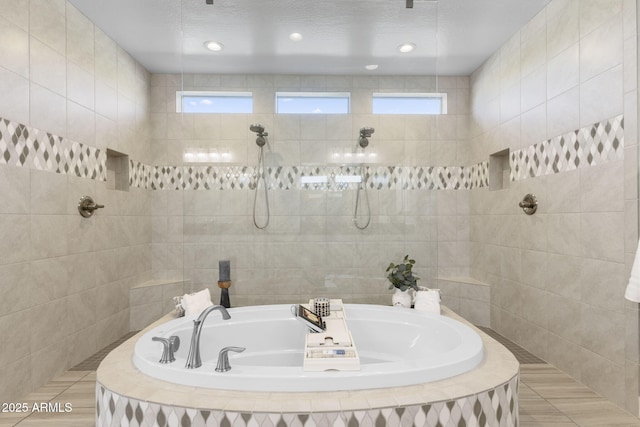 20795 W San Juan Ave, Buckeye, AZ 85396 - full bath featuring a bath, a tile shower, and tile walls