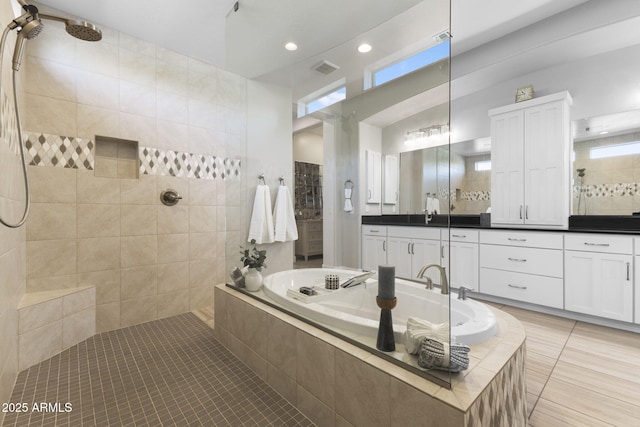 20795 W San Juan Ave, Buckeye, AZ 85396 - bathroom with tile patterned flooring, a bath, walk in shower, vanity, and recessed lighting