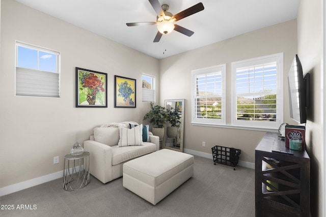 20795 W San Juan Ave, Buckeye, AZ 85396 - living area featuring carpet, a ceiling fan, and baseboards