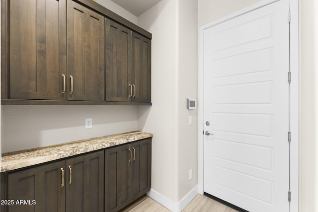 20795 W San Juan Ave, Buckeye, AZ 85396 - laundry area featuring baseboards and light wood-style flooring