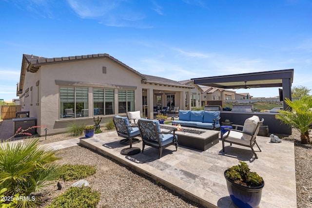 20795 W San Juan Ave, Buckeye, AZ 85396 - view of patio / terrace with an outdoor living space with a fire pit