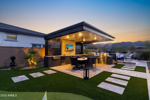 20795 W San Juan Ave, Buckeye, AZ 85396 - patio terrace at dusk with a patio and outdoor lounge area
