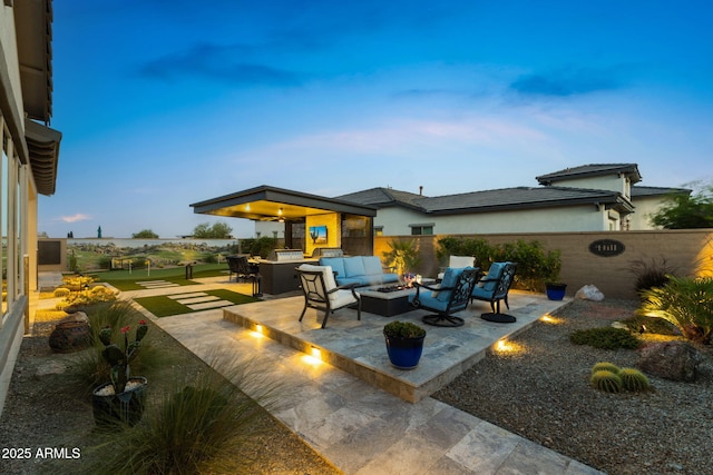 20795 W San Juan Ave, Buckeye, AZ 85396 - view of patio with an outdoor living space with a fire pit