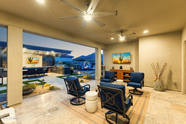 20795 W San Juan Ave, Buckeye, AZ 85396 - view of patio / terrace with a ceiling fan, outdoor dining space, and an outdoor hangout area