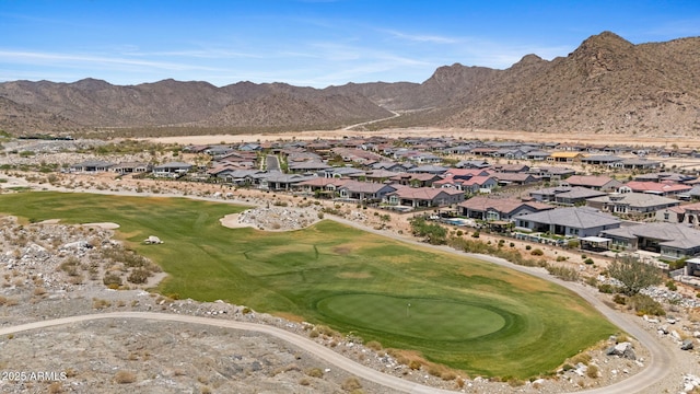 20795 W San Juan Ave, Buckeye, AZ 85396 - aerial view of property's location with nearby suburban area, a local golf course, and a mountainous background