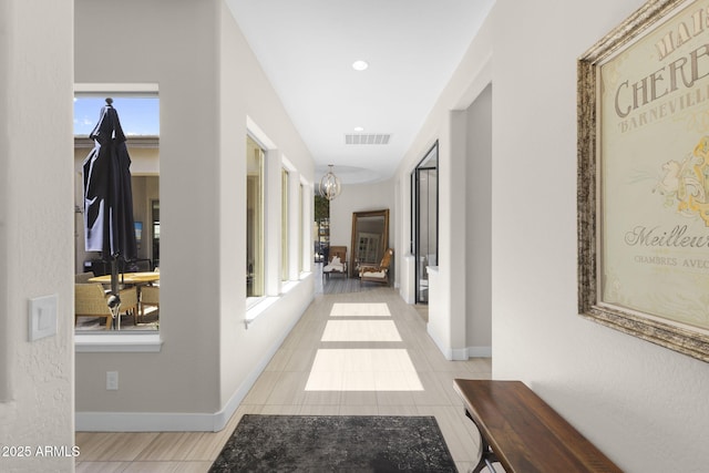 20795 W San Juan Ave, Buckeye, AZ 85396 - corridor featuring baseboards and tile patterned floors
