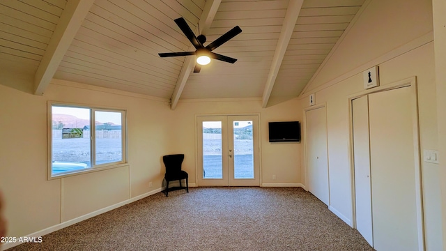 unfurnished bedroom featuring ceiling fan, french doors, lofted ceiling with beams, and carpet floors