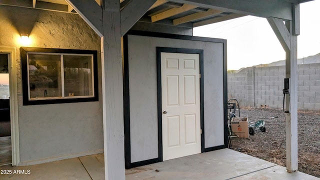 entrance to property featuring a patio area