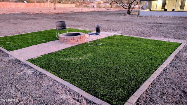 view of yard with an outdoor fire pit