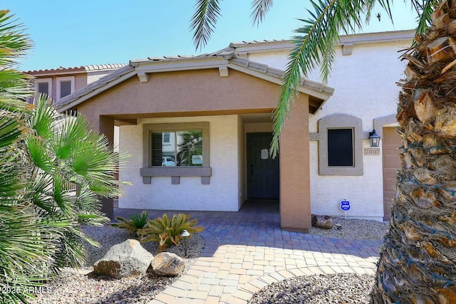 exterior space with stucco siding