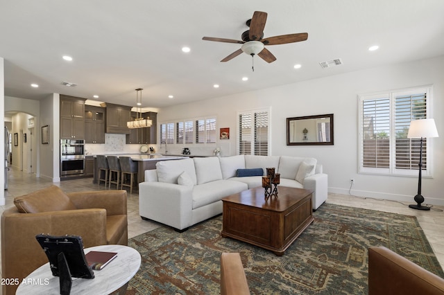 5332 E Thunder Hawk Rd, Cave Creek, AZ 85331 - living room with ceiling fan, recessed lighting, a chandelier, and arched walkways