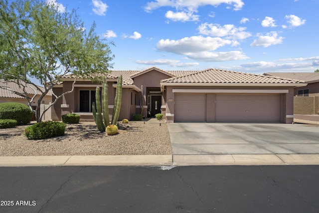 5332 E Thunder Hawk Rd, Cave Creek, AZ 85331 - view of front of property featuring an attached garage, concrete driveway, stucco siding, and a tile roof