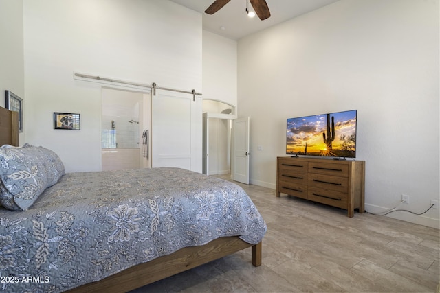 5332 E Thunder Hawk Rd, Cave Creek, AZ 85331 - bedroom featuring a towering ceiling, a barn door, and ceiling fan