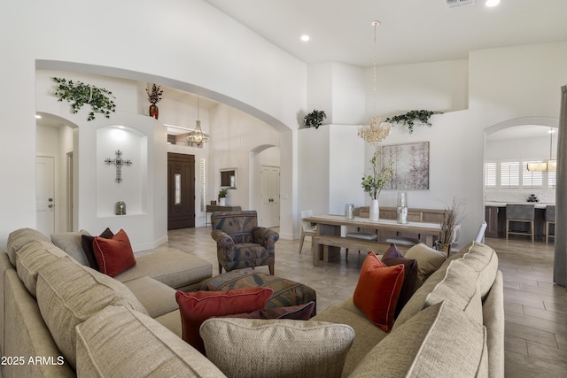 5332 E Thunder Hawk Rd, Cave Creek, AZ 85331 - living room featuring a high ceiling, arched walkways, and recessed lighting