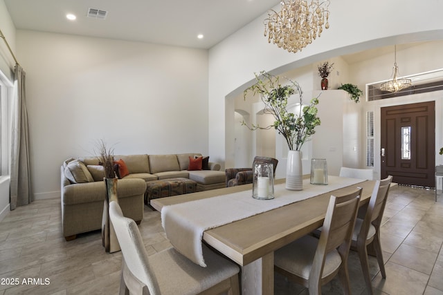 5332 E Thunder Hawk Rd, Cave Creek, AZ 85331 - dining room with a chandelier, arched walkways, recessed lighting, a high ceiling, and light tile patterned floors