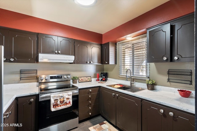 kitchen with electric stove, sink, light hardwood / wood-style flooring, light stone countertops, and dark brown cabinets