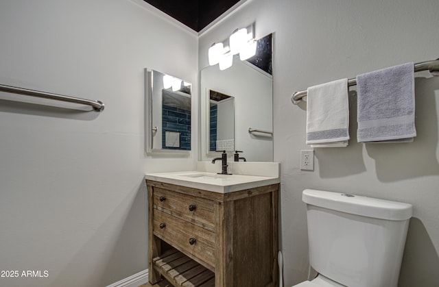 half bath featuring toilet and vanity