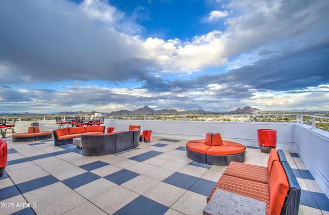 view of patio featuring an outdoor living space and a mountain view