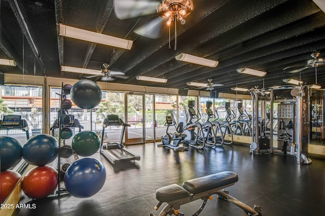 exercise room with ceiling fan