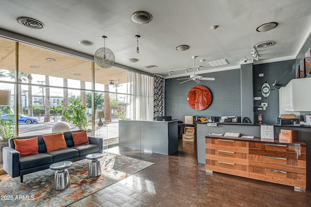 reception area featuring visible vents and ceiling fan