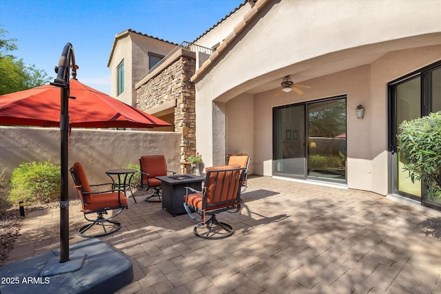 7445 E Eagle Crest Dr Unit 1015, Mesa, AZ 85207 - view of patio / terrace with a fire pit and a ceiling fan