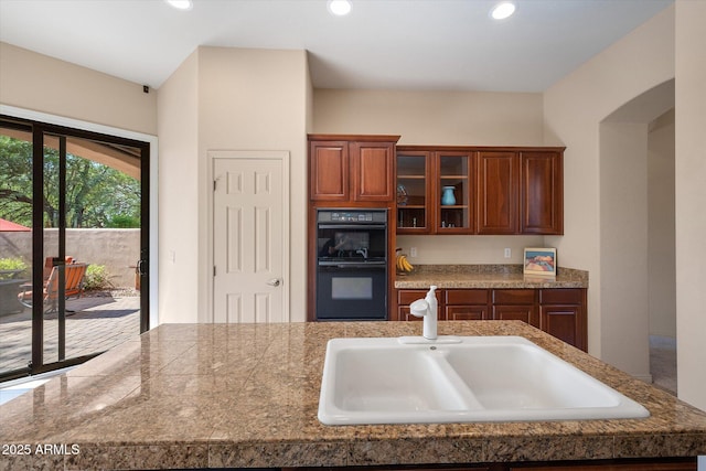 7445 E Eagle Crest Dr Unit 1015, Mesa, AZ 85207 - kitchen featuring a sink, glass insert cabinets, and recessed lighting