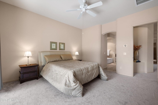7445 E Eagle Crest Dr Unit 1015, Mesa, AZ 85207 - bedroom featuring arched walkways, carpet floors, ceiling fan, and baseboards