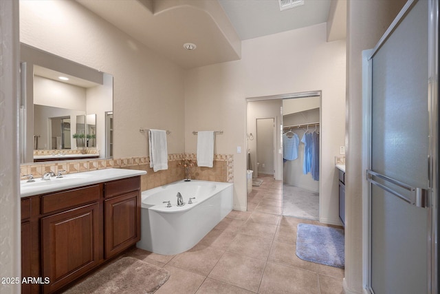 7445 E Eagle Crest Dr Unit 1015, Mesa, AZ 85207 - full bath with vanity, tile patterned floors, a garden tub, and a walk in closet