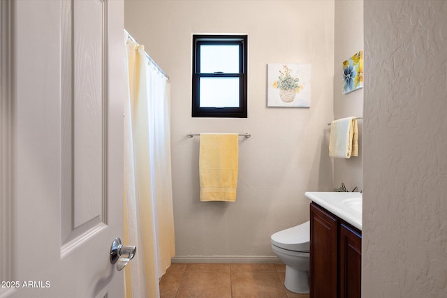 7445 E Eagle Crest Dr Unit 1015, Mesa, AZ 85207 - bathroom with toilet, tile patterned floors, vanity, and baseboards