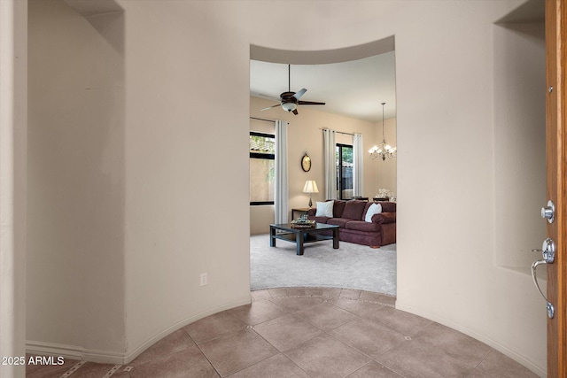 7445 E Eagle Crest Dr Unit 1015, Mesa, AZ 85207 - entryway with a ceiling fan, a chandelier, carpet floors, and baseboards
