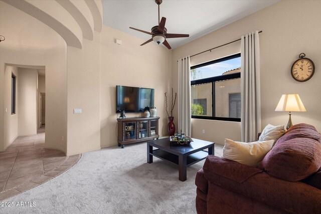 7445 E Eagle Crest Dr Unit 1015, Mesa, AZ 85207 - living room featuring ceiling fan, carpet flooring, and arched walkways