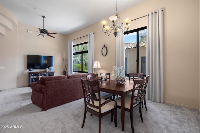 7445 E Eagle Crest Dr Unit 1015, Mesa, AZ 85207 - carpeted dining area featuring a chandelier and a ceiling fan