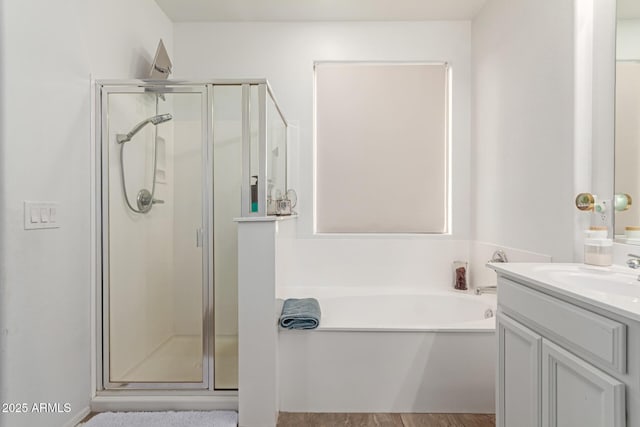 bathroom with vanity and plus walk in shower