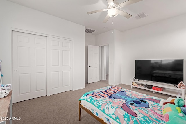 bedroom with a closet, ceiling fan, and carpet flooring