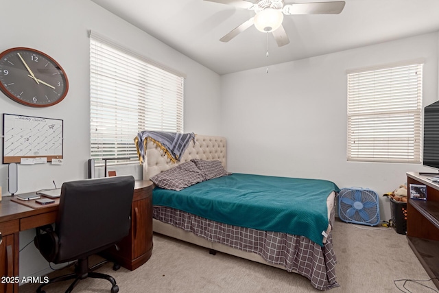 carpeted bedroom featuring ceiling fan