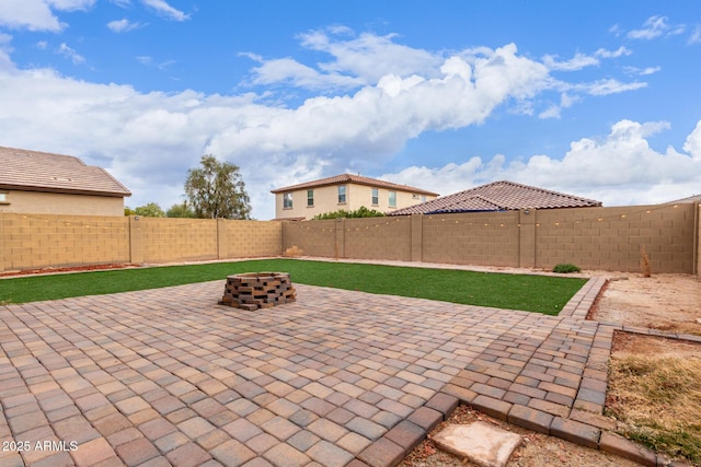 view of patio / terrace with an outdoor fire pit