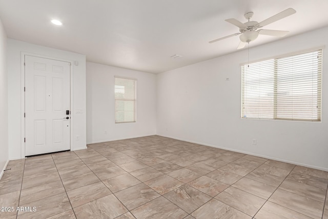 unfurnished room featuring ceiling fan