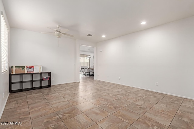 unfurnished room with ceiling fan