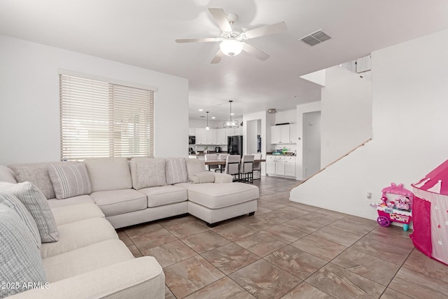 living room featuring ceiling fan