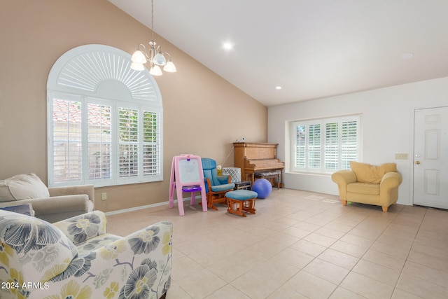 sitting room featuring light tile patterned flooring, lofted ceiling, and an inviting chandelier