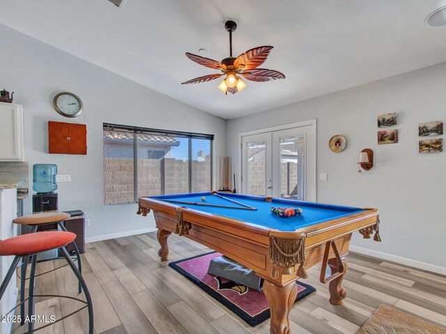 recreation room with lofted ceiling, light hardwood / wood-style flooring, pool table, and french doors