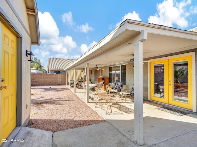 view of patio with ceiling fan and french doors