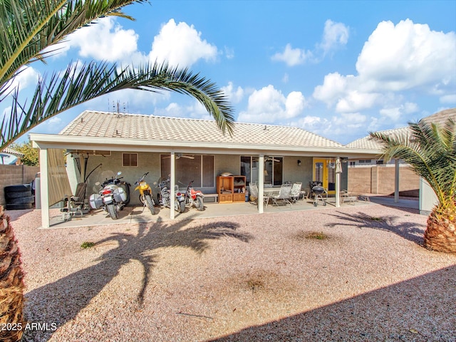 back of property featuring a patio