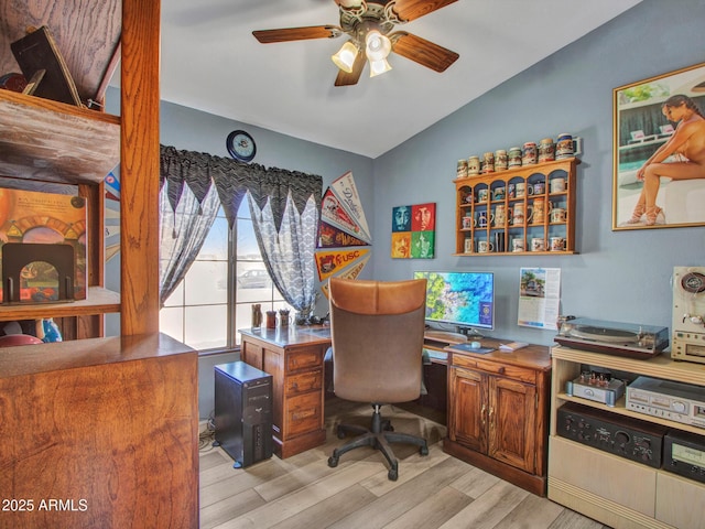 home office featuring ceiling fan, lofted ceiling, and light wood-type flooring