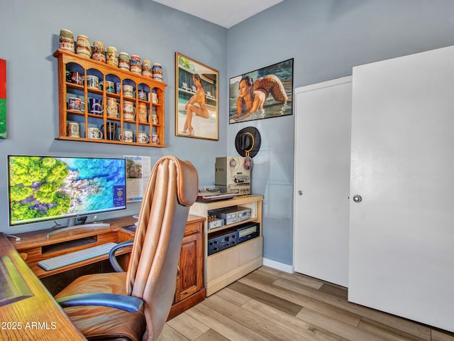 office with light hardwood / wood-style floors