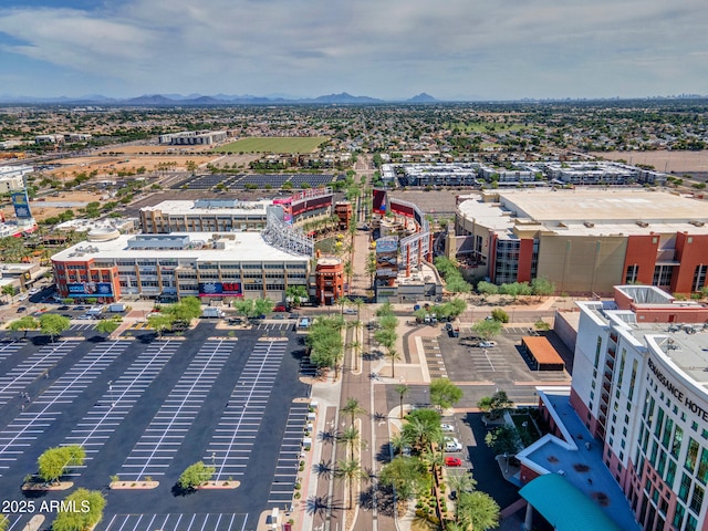 birds eye view of property with a mountain view