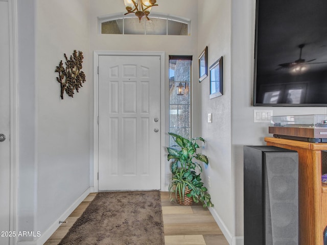 entryway with light hardwood / wood-style floors and ceiling fan